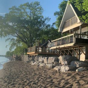 Beach access and balcony lake views at a Dream BNB Hospitality Point Pelee Cottage Rental.