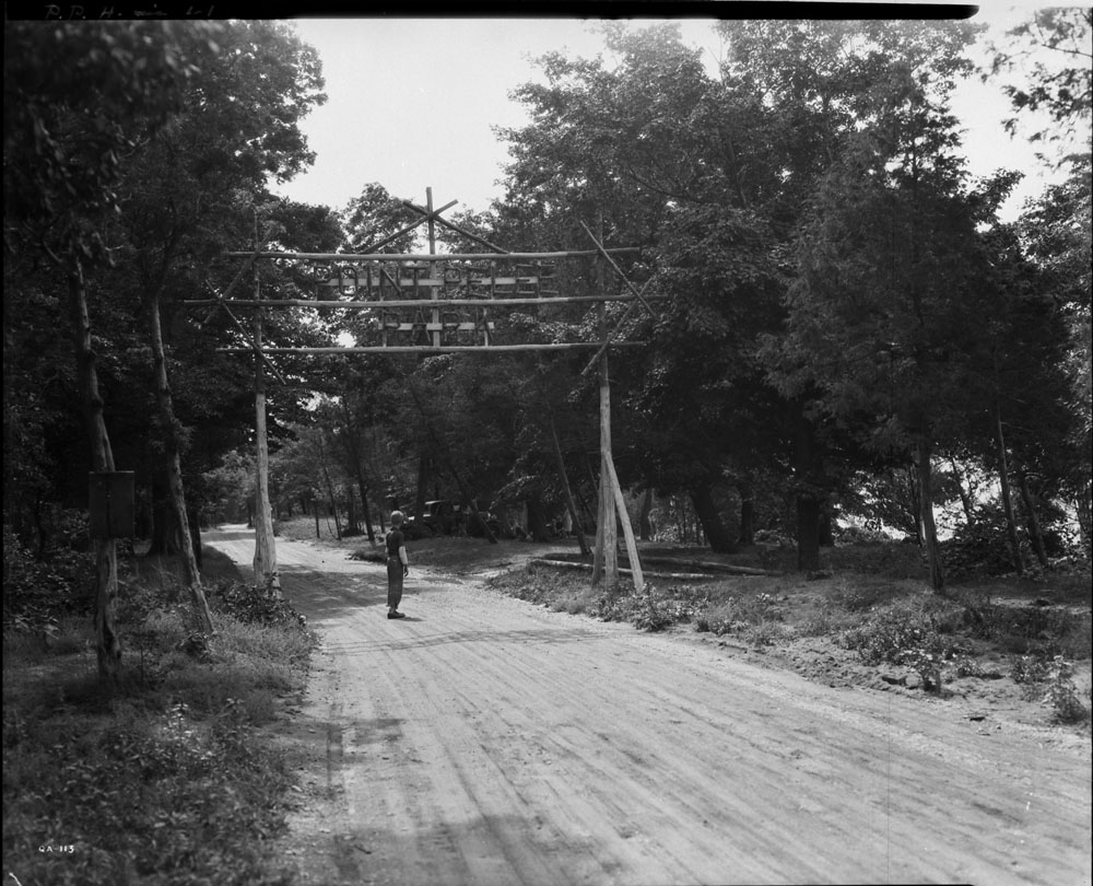 Original gate of Point Pelee National Park made of rustic wood beams.