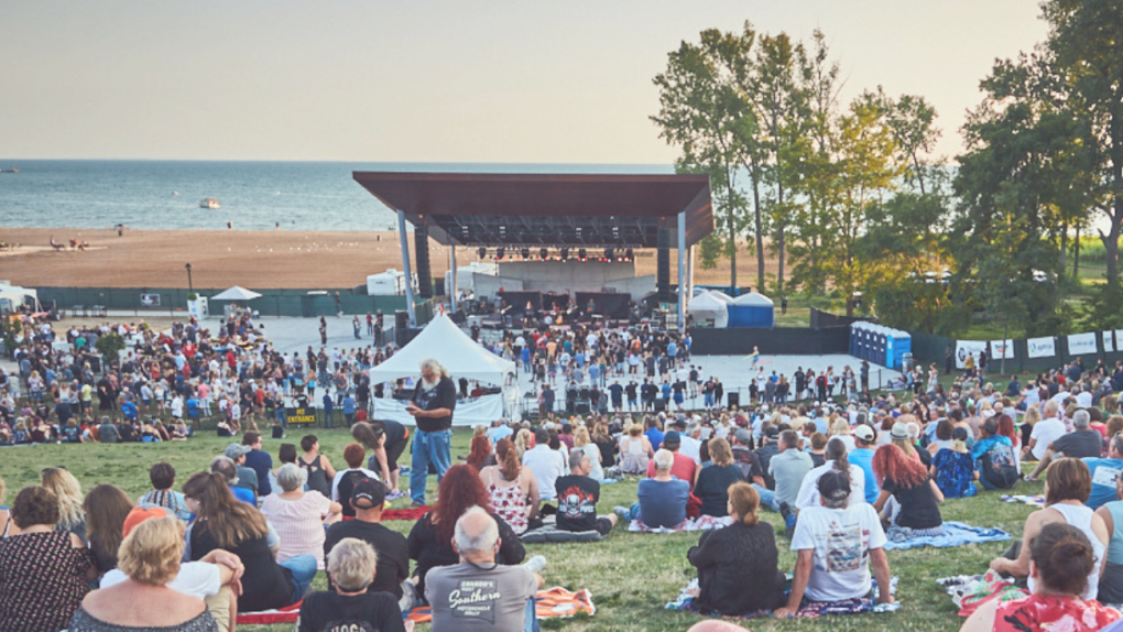 Crowd enjoys a free lice music concert at the Sunset Amphitheatre at Seacliff Park and Beach in Essex County