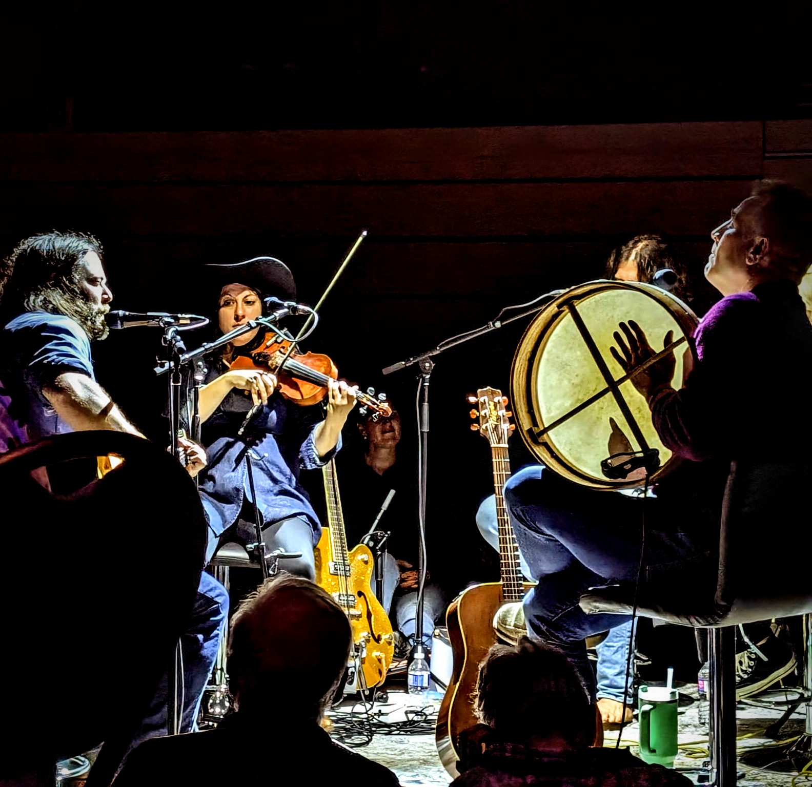 Musicians performing in the round at the Bank Theatre